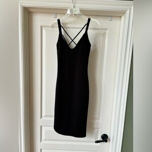 The perfect little black dress, lightweight, size medium, with stretch, to hug.